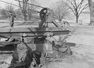 Possibly: Clearing earth and old paving for extension...at Fourteenth, Washington, D.C, 1942. Creator: Dorothea Lange.