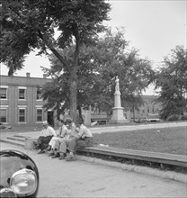 Men idling around the courthouse square, Roxboro, North Carolina, 1939. Creator: Dorothea Lange.