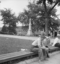 Men idling around the courthouse square, Roxboro, North Carolina, 1939. Creator: Dorothea Lange.