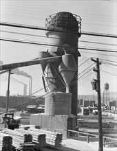 Lumber burner and stacks of the Big Lakes Lumber Company..., Klamath Falls, Oregon, 1939. Creator: Dorothea Lange.