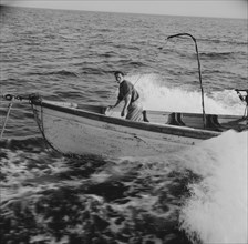 Giacomo Frusteri in the prow of the seining boat as it races to..., Gloucester, Massachusetts, 1943. Creator: Gordon Parks.