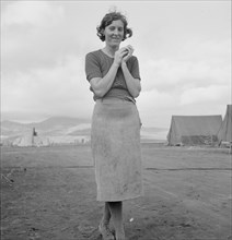 Young migrant mother has just finished washing, Merrill FSA camp, Klamath County, Oregon, 1939. Creator: Dorothea Lange.