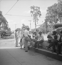 Possibly: Saturday afternoon shopping and visiting on main street of Pittsboro, North Carolina, 1939 Creator: Dorothea Lange.