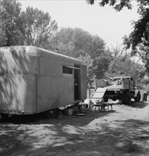 Possibly: The house trailer and the youngest little girl, Washington, Yakima Valley, Toppenish, 1939 Creator: Dorothea Lange.