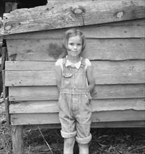Eight year old daughter who helps about the tobacco barn..., Granville County, North Carolina, 1939. Creator: Dorothea Lange.