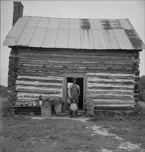 Possibly: Young sharecropper and his first child, Hillside Farm, Person County, North Carolina, 1939 Creator: Dorothea Lange.