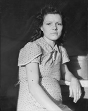 Daughter of migratory family in FSA labor camp, Calpatria, Imperial Valley, California, 1939. Creator: Dorothea Lange.