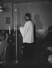 Reverend Vondell Gassaway, pastor of the St. Martin's Spiritual Church..., Washington, D.C., 1942. Creator: Gordon Parks.