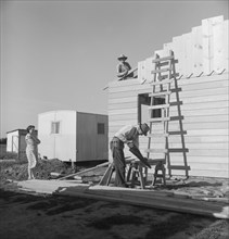 Father and son building house on outskirts of Salinas, California, 1939. Creator: Dorothea Lange.