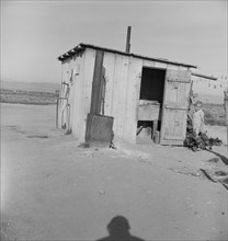 Laundry facilities for ten cabins at Arkansawyers auto camp, Salinas Valley, CA , 1939. Creator: Dorothea Lange.