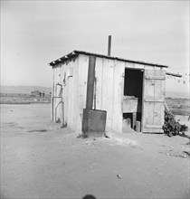 Laundry facilities for ten cabins at Arkansawyers auto camp, Salinas Valley, California, 1939. Creator: Dorothea Lange.