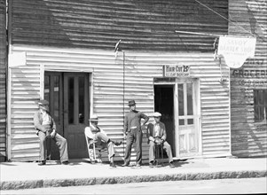 Vicksburg Negroes and shop front, Mississippi, 1936. Creator: Walker Evans.