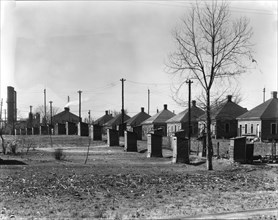 Steelmill workers' company houses and outhouses, Republic Steel Company, Birmingham, Alabama, 1936. Creator: Walker Evans.