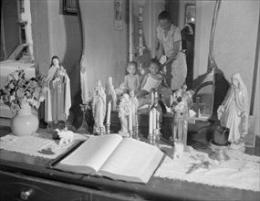 Religious objects and an improved altar in the bedroom..., Washington, D.C., 1942. Creator: Gordon Parks.