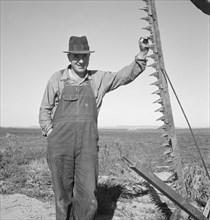 Farmer in his field getting ready to mow hay, Dead Ox Flat, Oregon, 1939. Creator: Dorothea Lange.
