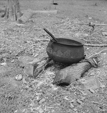 Iron pot for heating...in the yard of Negro tobacco farmer, Person County, North Carolina, 1939. Creator: Dorothea Lange.