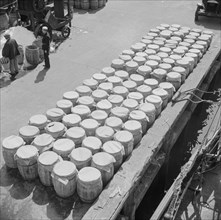 Barrels of fish on the docks at Fulton fish market ready to be shipped to retailers, New York, 1943. Creator: Gordon Parks.