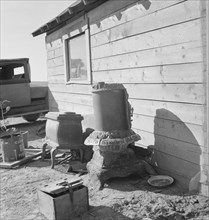Stoves outside the Browning house being repaired for winter use, Dead Ox Flat, Oregon, 1939. Creator: Dorothea Lange.