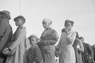 Negroes in the lineup for food at meal time in the camp for flood refugees, Forrest City, Arkansas.