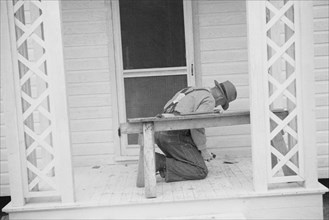 [Untitled photo, possibly related to: Carpenter at work, Eatonton, Georgia. Briar Patch Project].
