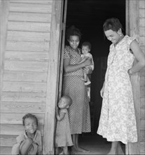 Two tobacco tenant mothers (related) with part of their children. Wake County, North Carolina.