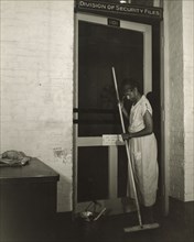 Washington, D.C. Government charwoman cleaning after regular working hours. [Mrs Ella Watson].