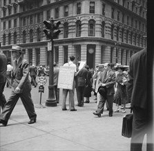 42nd Street and Madison Avenue. Street hawker selling Consumer's Bureau Guide. New York City.