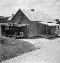 Home of Negro tobacco tenant with addition of improvised garage. Wake County, North Carolina.