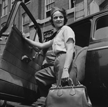 New Britain, Connecticut. Women employed at Landers, Frary and Clark plant. A shuttle driver.