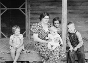 Wife and children of tobacco sharecropper on front porch. Person County, North Carolina.
