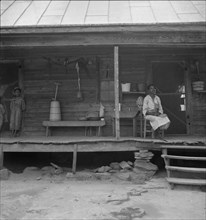Porch of Negro tenant house, showing household equipment. Person County, North Carolina.