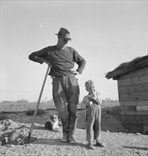 Mr. Dougherty and one of the children. Warm Springs district, Malheur County, Oregon.
