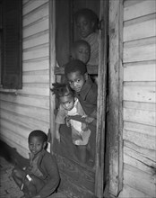 Washington (southwest section), D.C. Negro children in the front door of their home.
