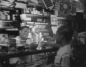 Washington, D.C. Clerk waiting on a customer in the store owned by Mr. J. Benjamin.