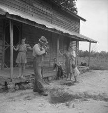 Tobacco sharecropper ready to return to the field. Person County, North Carolina.