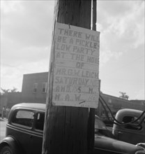 Sign tacked to pole near the post office. Main street, Pittsboro, North Carolina.