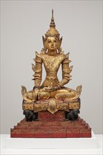 Crowned and Bejewelled Buddha Seated on an Elephant Throne, Late 19th century.