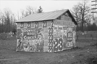 Posters covering a building near Lynchburg to advertise a Downie Bros. circus.