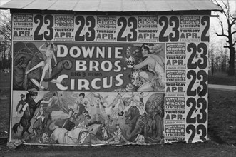 Posters covering a building near Lynchburg to advertise a Downie Bros. circus.