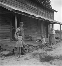 Tobacco sharecropper with his oldest daughter. Person County, North Carolina].