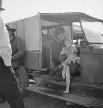 Mother and baby of family on the road. Tulelake, Siskiyou County, California.