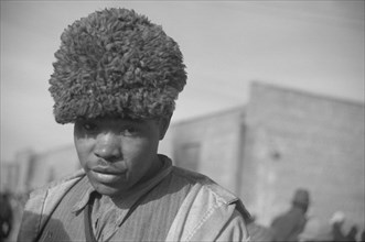 Negro with a fur cap, a flood refugee in the camp at Forrest City, Arkansas.