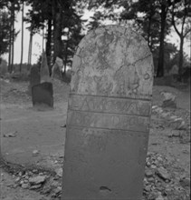Tombstone in a red clay Negro cemetery. Person County, North Carolina.
