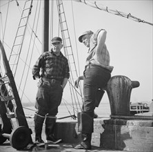 New York, New York. New England fishermen resting on the Fulton docks.