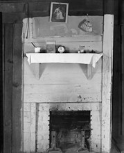 Fireplace in bedroom of Floyd Burroughs' cabin. Hale County, Alabama.