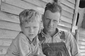Charles and his father Floyd Burroughs, Alabama cotton sharecropper.