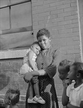 Washington, D.C. Young girl with her sister who live on Seaton Road.