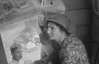 Farm woman in conversation with relief investigator, West Virginia.