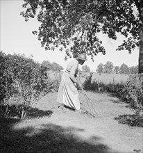 Caroline Atwater, wife of Negro owner, has a well-swept yard.