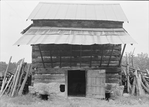 Tobacco barn with front shelter. Olive Hill, North Carolina.